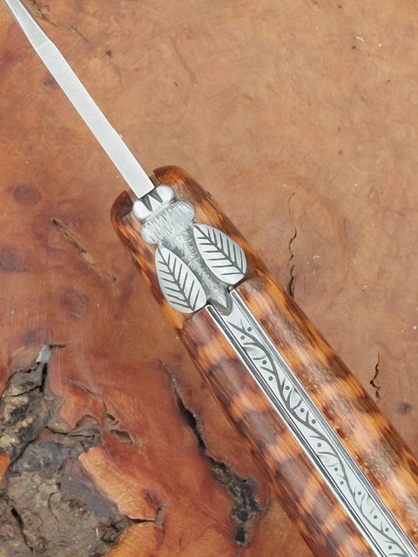 Mouche travaillée, ressort guilloché, manche Amourette. munoz virgilio